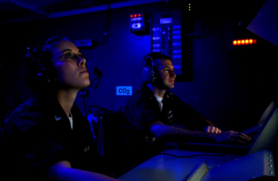 US Navy 090416-N-6597H-183 Fire Controlman 3rd Class Margaret Opdycke and Fire Controlman 1st Class Jason May monitor control track consoles in NATO Sea Sparrow Controller Two aboard the aircraft carrier USS John C. Stennis (CV