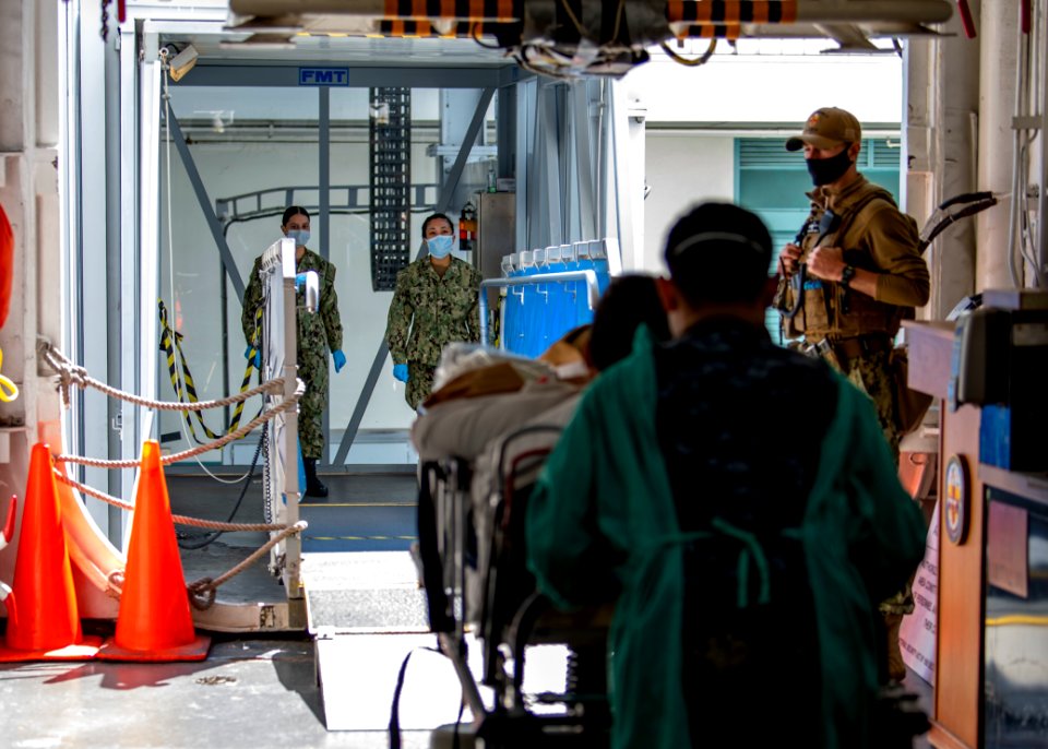 USNS Mercy Sailors Prepare Patient for Discharge (49826963056)