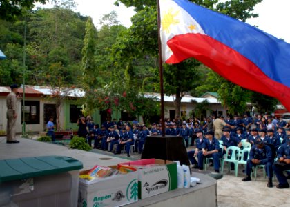 US Navy 090418-N-9950J-252 Chaplain Cmdr. Yin Dang speaks to Sailors assigned to the amphibious assault ship USS Essex (LHD 2) before a community service project at Barretto National High School