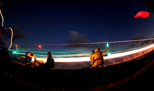 US Navy 090418-N-6538W-300 Flight deck personnel launch an F-A-18C Hornet
