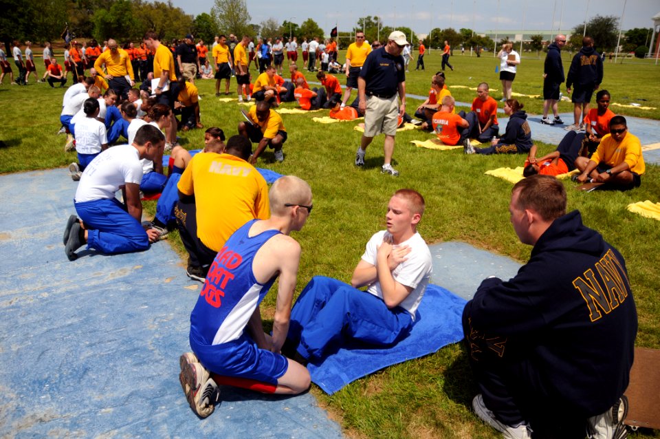 US Navy 090417-N-8848T-300 Damage Controlman 1st Class Jerry Wirth, a recruiter from Naval Recruiting District Los Angeles monitors a Navy Junior ROTC cadet performing curl-ups