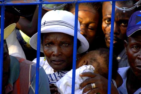 US Navy 090418-F-7923S-023 A Haitian woman waits her turn for treatment at the Killick medical clinic site during a Continuing Promise community medical service project photo