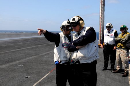 US Navy 090416-N-7730P-095 Adm. Sir Jonathon Band, right, First Sea Lord and Chief of Naval Staff of the Royal Navy, and a fellow Royal Navy officer share a short conversation while standing on the flight deck of the aircraft c