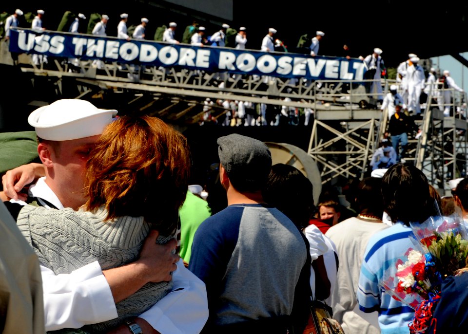 US Navy 090418-N-9116H-026 Family and friends greet Sailors assigned to USS Theodore Roosevelt (CVN 71) and Carrier Air Wing (CVW) 8 during a homecoming celebration