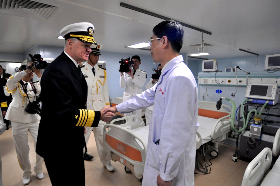 US Navy 090420-N-8273J-461 Chief of Naval Operations (CNO) Adm. Gary Roughead speaks with doctors aboard the People's Liberation Army Navy type 920 hospital ship Daishandao (AHH 866)