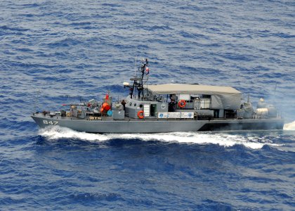 US Navy 090421-N-0120A-044 The Armed Forces of the Philippines Navy patrol boat BRP Leopoldo Regis (PG-847) maneuvers into position at the head of a formation exercise with the amphibious assault ship USS Essex (LHD 2)