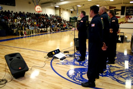 US Navy 090420-N-5366K-099 Chief Special Warfare Boat Operator (SWCC) J.C. Ledbetter, front, assigned to the Navy Parachute Team, speaks with students at Riverview Gardens High School in St. Louis about life in Naval Special Wa photo