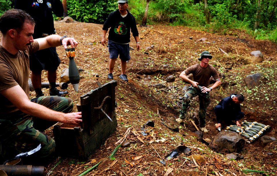US Navy 090418-N-7130B-071 Members of the Joint Special Operations Task Force-Philippines Explosive Ordnance Disposal Task Unit help members of the Armed Forces of the Philippines Army Explosive Ordnance Disposal Battalion stac