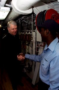 US Navy 090420-N-1251W-014 Chief of Naval Operations (CNO) Adm. Gary Roughhead speaks with a Sailor assigned to the Arleigh Burke-class guided-missile destroyer USS Fitzgerald (DDG 62) during a tour of the ship