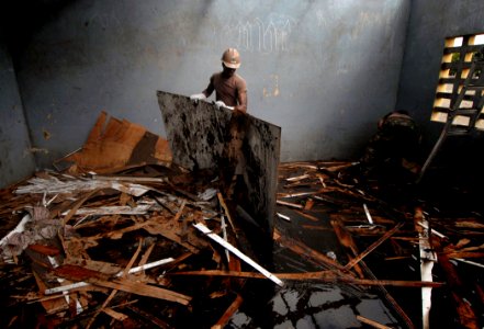 US Navy 090422-N-1688B-091 Steelworker 1st Class Kajuna Strickland clears out a room at the Balise School in Port Gentil during an Africa Partnership Station community outreach project photo