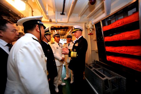 US Navy 090420-N-8273J-114 Chief of Naval Operations (CNO) Adm. Gary Roughead, receives a tour of the People's Liberation Army Navy Destroyer Luyang 2 while visiting with senior PLA naval leadership in Qingdao, China