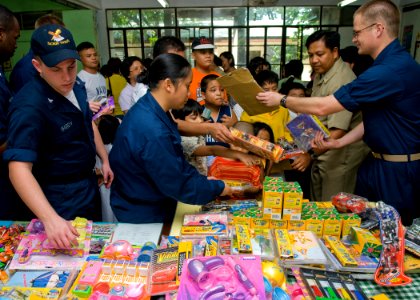 US Navy 090419-N-5253W-070 Sailors from Amphibious Squadron (PHIBRON) 11 and the Armed Forces of the Philippines Navy hand out toys