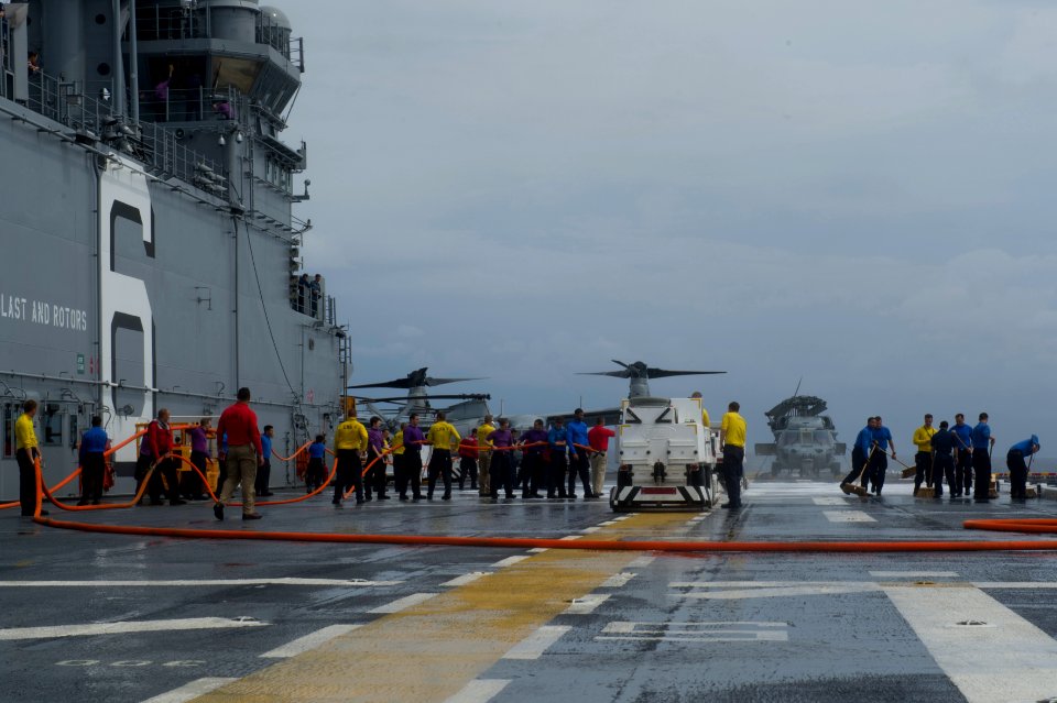 USS America deck scrubbing 140911-N-MZ309-053