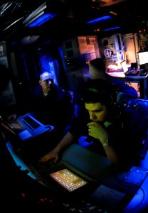 US Navy 090420-N-9928E-233 Sonar Technicians (Surface) track and report simulated mines during an under-sea warfare training scenario in the sonar room aboard the Arleigh Burke-class guided-missile destroyer USS Kidd (DDG 100) photo