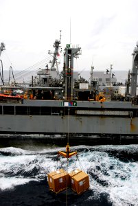 US Navy 090423-N-6597H-039 Pallets of supplies are shuttled between the Military Sealift Command fleet replenishment oiler USNS Tippecanoe (T-AO 199) and the aircraft carrier USS John C. Stennis (CVN 74) during a replenishment