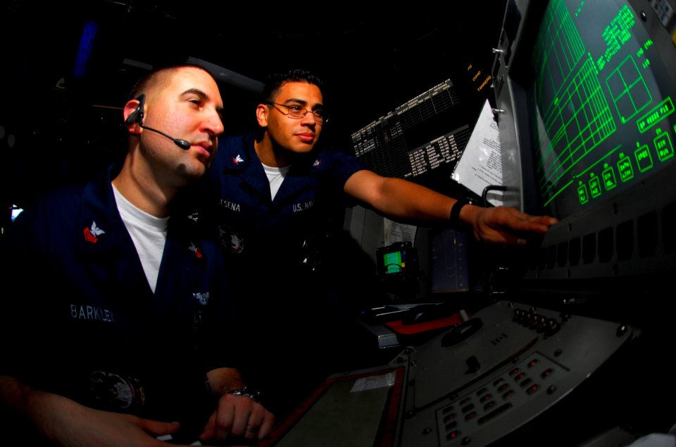 US Navy 090422-N-6597H-038 Air Traffic Controller 1st Class Jeff Barkley, left, and Electronics Technician 3rd Class John Cesena, monitor the SPN-46 automated control landing radar system