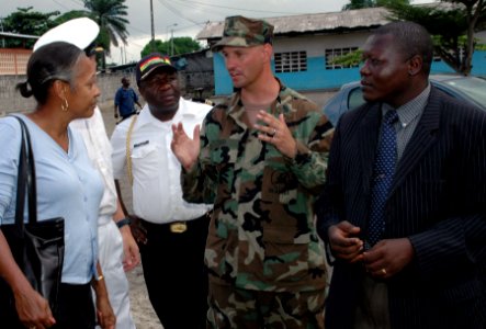 US Navy 090422-N-1655H-161 Chief Builder Paul Reed discusses Africa Partnership Station Nashville community outreach projects with U.S. Ambassador to Gabon Eunice Reddick