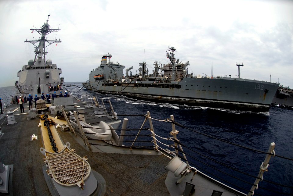 US Navy 090423-N-3541A-032 The Arleigh Burke-class destroyer USS Kidd (DDG 100), conducts a replenishment at sea with the Military Sealift Command fleet replenishment oiler USNS Tippecanoe (T-AO 199)