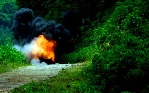 US Navy 090422-N-7130B-318 A fireball erupts as dynamite and TNT are used to clear boulders