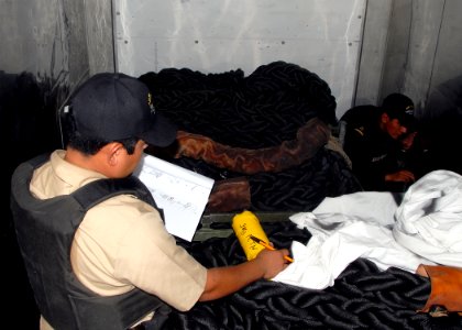 US Navy 090426-N-2821G-203 Members of a Mexican Navy boarding team find hidden contraband aboard the German Navy combat support ship Frankfurt am Main (A-1412) during the maritime interdiction operation exercise portion of UNIT photo