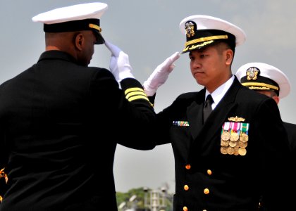 US Navy 090423-N-2013O-104 Cmdr. H.B. Le assumes command of the Arleigh Burke-class guided-missile destroyer USS Lassen (DDG 82), relieving Cmdr. Anthony Simmons