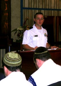 US Navy 090427-N-0995C-012 Lt. Dennis Kelly reads an excerpt of Reverend Martin Niemoller's poem, First they came.