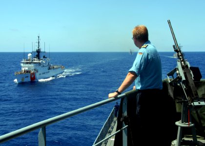 US Navy 090426-N-2821G-039 A German sailor watches U.S. Coast Guard cutter Thetis (WMEC 910) pull alongside the German navy combat support ship Frankfurt am Main (A-1412) during a UNITAS Gold replenishment at sea training exerc photo