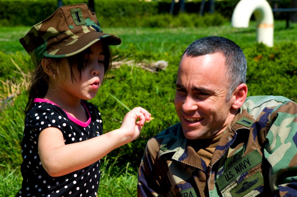 US Navy 090424-N-9552I-021 Lt. j.g. Angel Olivera spends time with his daughter during a Month of the Military Child
