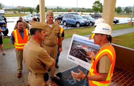 US Navy 090429-N-1906L-002 ice Adm. Michael Vitale, commander, Navy Installations Command, speaks with Rear Adm. Bill French, commander, Joint Region Marianas, about facility issues photo