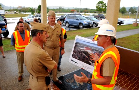 US Navy 090429-N-1906L-002 ice Adm. Michael Vitale, commander, Navy Installations Command, speaks with Rear Adm. Bill French, commander, Joint Region Marianas, about facility issues