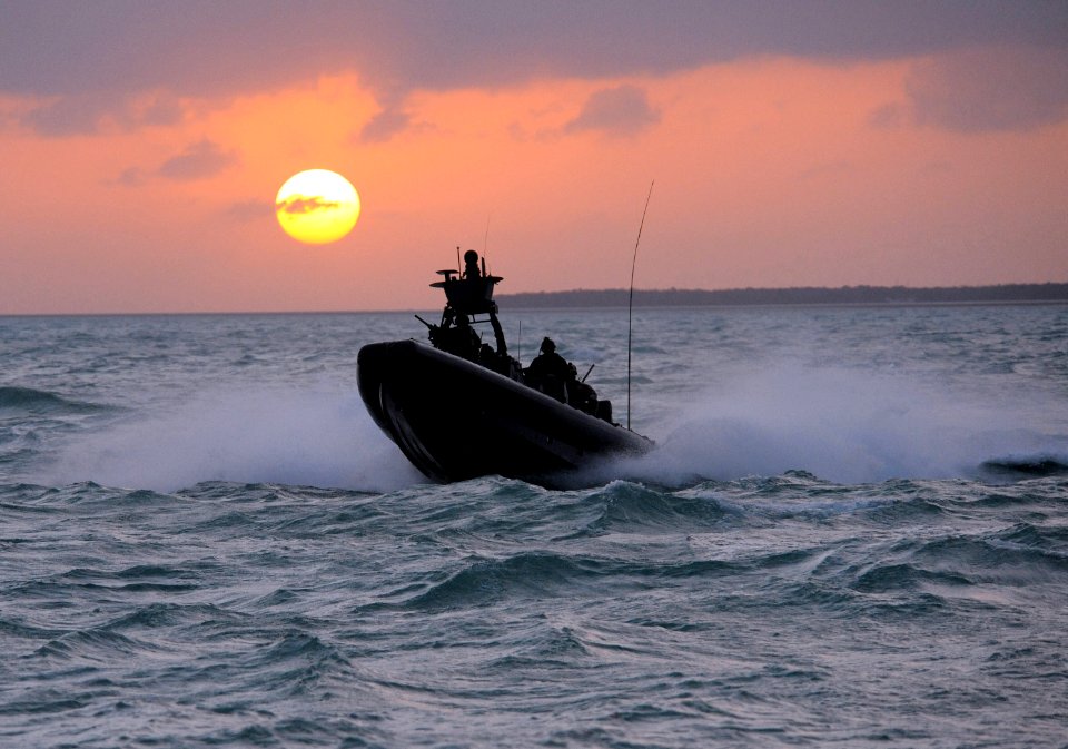 US Navy 090427-N-4205W-494 A Special Warfare Combatant-Craft Crewman (SWCC) assigned to Special Boat Team (SBT) 20 navigates a rigid-hull inflatable boat