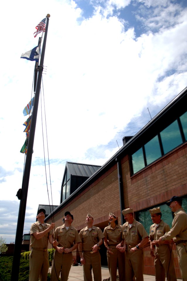 US Navy 090429-N-9818V-315 Master Chief Petty Officer of the Navy (MCPON) Rick West and senior leadership from Destroyer Squadron (DESRON) 9 raise their pennant flag for the first time after relocating to a new building at Nava