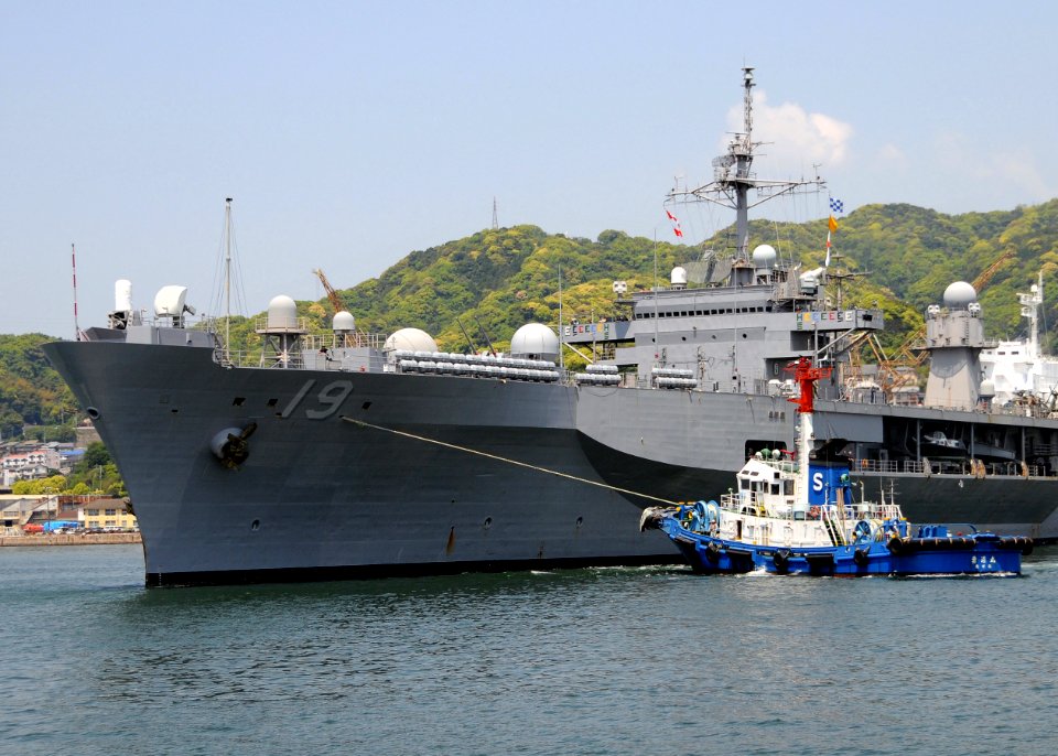 US Navy 090429-N-0807W-322 A tugboat guides the amphibious command ship USS Blue Ridge (LCC 19) as it departs Fleet Activities Sasebo after a scheduled port visit