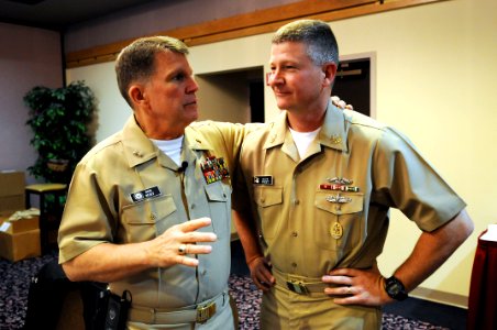 US Navy 090428-N-9818V-017 Master Chief Petty Officer of the Navy (MCPON) Rick West speaks with Chief of Navy Chaplains Rear Adm. Robert F. Burt before kicking off the Individual Agumentee Symposium at Naval Base Kitsap Bangor