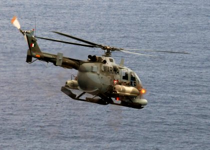 US Navy 090429-N-2821G-139 A Mexican BO-105 Bolkow helicopter fires 2.75 inch high-explosive rockets at the ex-USS Connolly (DD 979) during the sinking exercise portion of UNITAS Gold