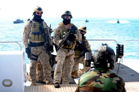 US Navy 090428-N-4205W-585 A Special Warfare Combatant-Craft Crewman (SWCC) assigned to Special Boat Team (SBT) 20 prepare to take down a yacht for a scene in the upcoming Bandito Brothers production photo