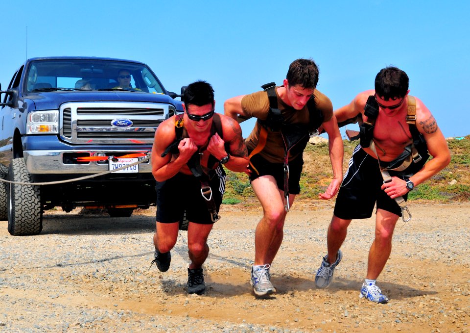 US Navy 090430-N-4021H-070 Search and rescue (SAR) swimmers pull a pick-up truck during a SAR competition at Naval Air Station North Island