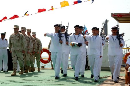 US Navy 090430-N-8053S-102 U.S. and Iraqi sailors march on the Khawr Al Amaya Oil Terminal off the coast of Basra in the Persian Gulf during a ceremony to turn over control of the terminal from the U.S. Navy to the Iraqi Navy