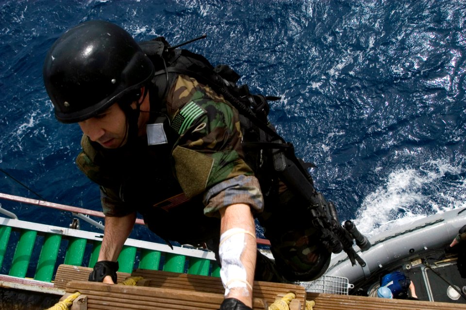 US Navy 090501-N-1251W-049 Quartermaster 1st Class Marc Morency, a member of the visit, board, search and seizure team aboard the guided-missile destroyer USS Fitzgerald (DDG 62), climbs a pilot ladder to board the Indian Navy