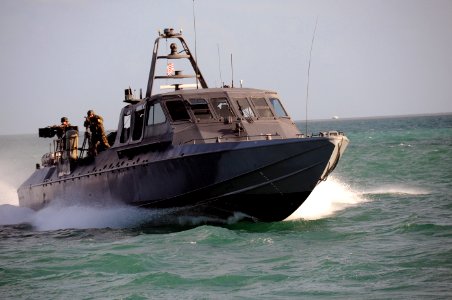 US Navy 090428-N-4205W-840 A Special Warfare Combatant-Craft Crewman (SWCC) assigned to Special Boat Team (SBT) 20 navigates the MARK V Special Operations Craft for a scene in the upcoming Bandito Brothers production photo