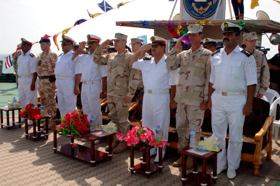 US Navy 090430-N-8053S-031 Dignitaries render a hand salute at the beginning of a ceremony to turn over control of the Khawr Al Amaya Oil Terminal off the coast of Basra from the U.S. Navy to the Iraqi Navy