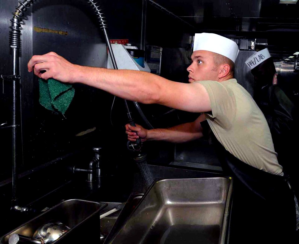 US Navy 090502-A-3007S-082 Army Cpl. Edmund Hollub of the 807th Medical Command volunteers in the kitchen on board the hospital ship USNS Comfort (T-AH 20)