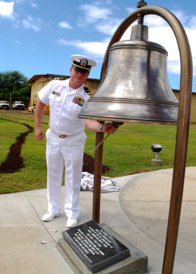 US Navy 090501-N-0995C-039 Lt. Cmdr. Jay Gulley, officer-in-charge of the U.S. Naval Ammunition Depot, Oahu, rings a bell recovered from the aircraft carrier USS Hornet (CV 8) that was dedicated to the command for its 75th anni