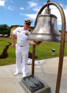 US Navy 090501-N-0995C-039 Lt. Cmdr. Jay Gulley, officer-in-charge of the U.S. Naval Ammunition Depot, Oahu, rings a bell recovered from the aircraft carrier USS Hornet (CV 8) that was dedicated to the command for its 75th anni