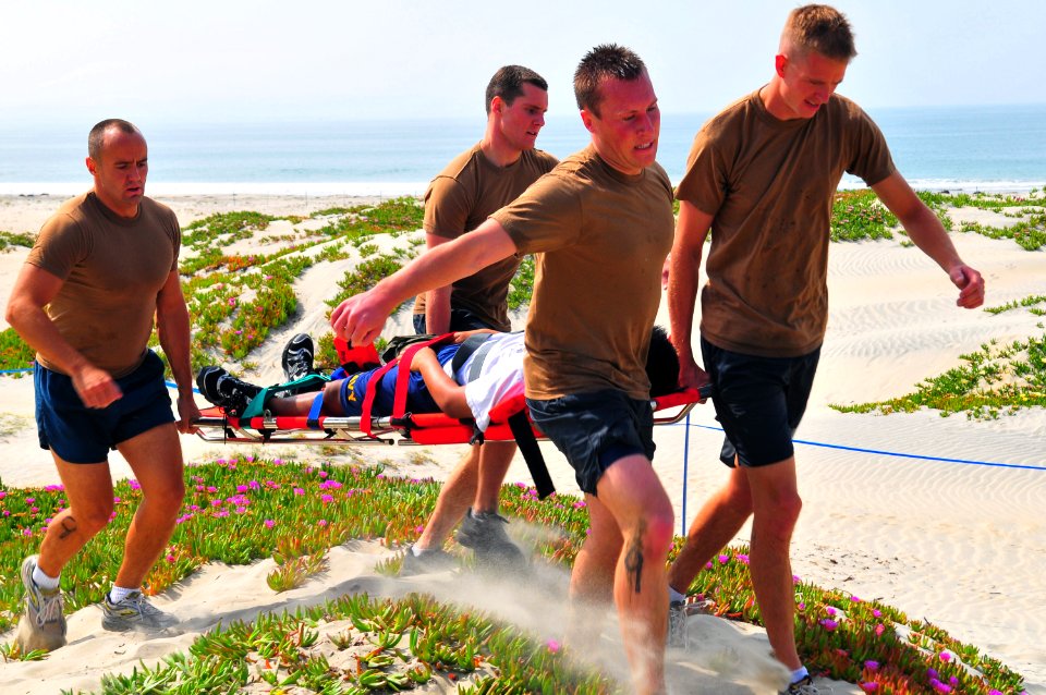 US Navy 090430-N-4021H-063 Search and rescue (SAR) swimmers carry a simulated casualty during a SAR competition at Naval Air Station North Island
