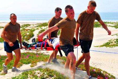 US Navy 090430-N-4021H-063 Search and rescue (SAR) swimmers carry a simulated casualty during a SAR competition at Naval Air Station North Island