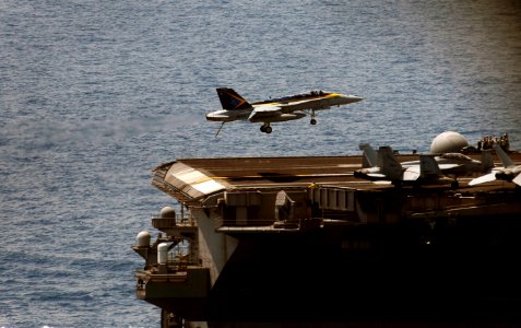 US Navy 090504-N-9928E-212 An F-A-18C Hornet from the Blue Diamonds of Strike Fighter Squadron (VFA) 146 lands on the flight deck of the Nimitz-class aircraft carrier USS John C. Stennis (CVN 74) during an airborne change of co