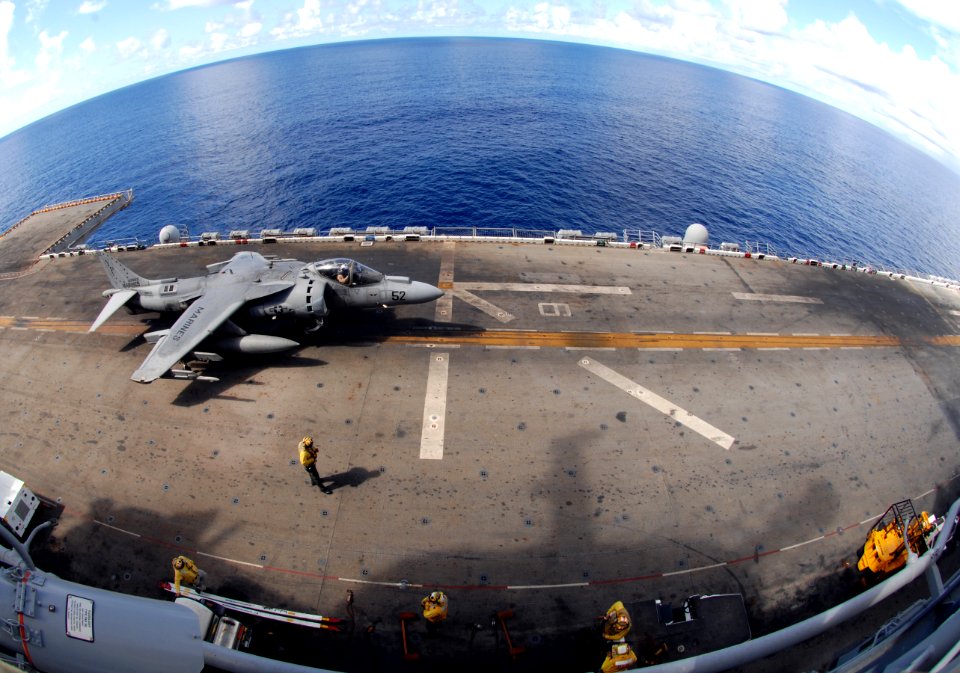 US Navy 090503-N-6639M-119 Sailors assigned to Marine Medium Helicopter Squadron (HMM) 163 and air handlers assigned to the amphibious assault ship USS Boxer (LHD 4) conduct AV-8B harrier flight operations