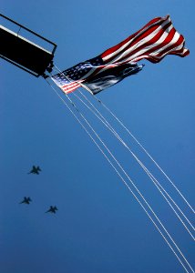 US Navy 090504-N-6538W-032 Aircraft from Carrier Air Wing (CVW) 9 fly over the mast of the Nimitz-class aircraft carrier USS John C. Stennis (CVN 74) during flight operations