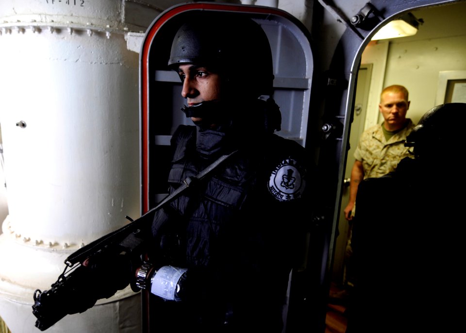 US Navy 090501-N-7280V-218 A member of the Indian Navy boards the amphibious command ship USS Blue Ridge (LCC 19) as he conducts a visit, board, search and seizure drill during Exercise Malabar 2009
